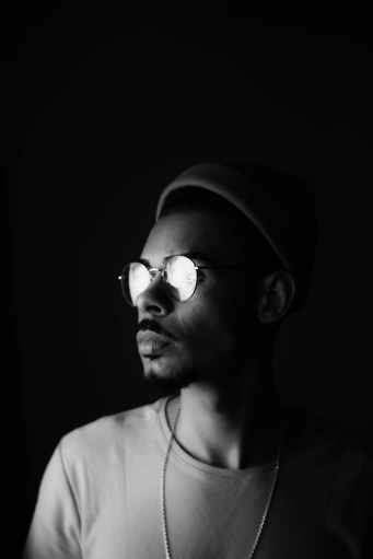 grayscale photography of man looking sideways