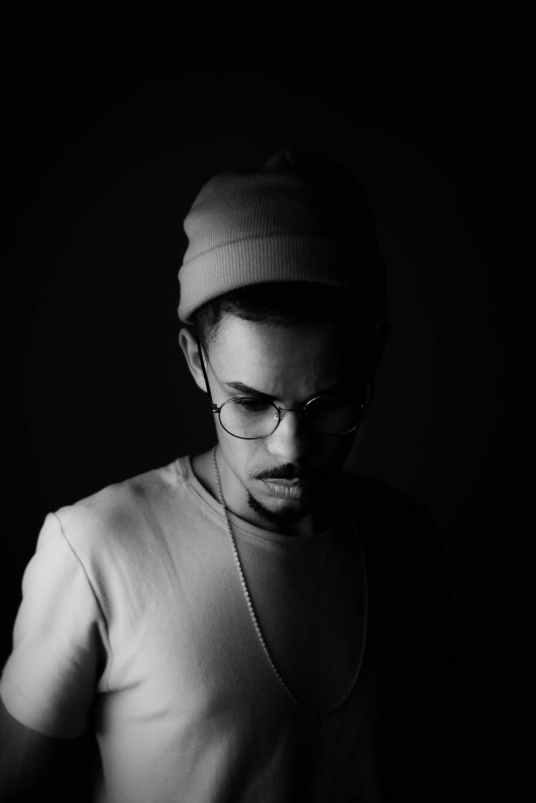 black and white photo of man wearing eyeglasses